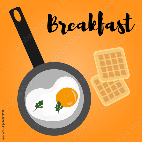 Scrambled eggs for breakfast in a pan and Belgian waffles