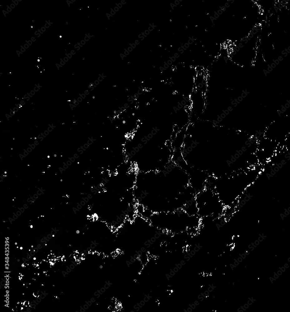 Splashes and drops of water are on a black background. Splashes and drops of water are on a black background.