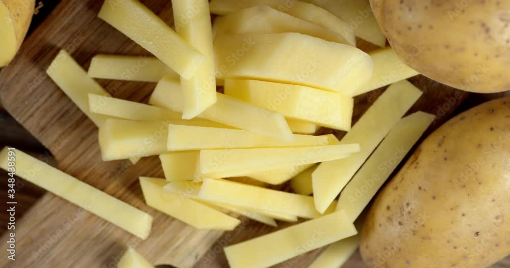 Sliced fresh potatoes on the cutting Board slowly rotates. Sliced fresh potatoes on the cutting Board slowly rotates.