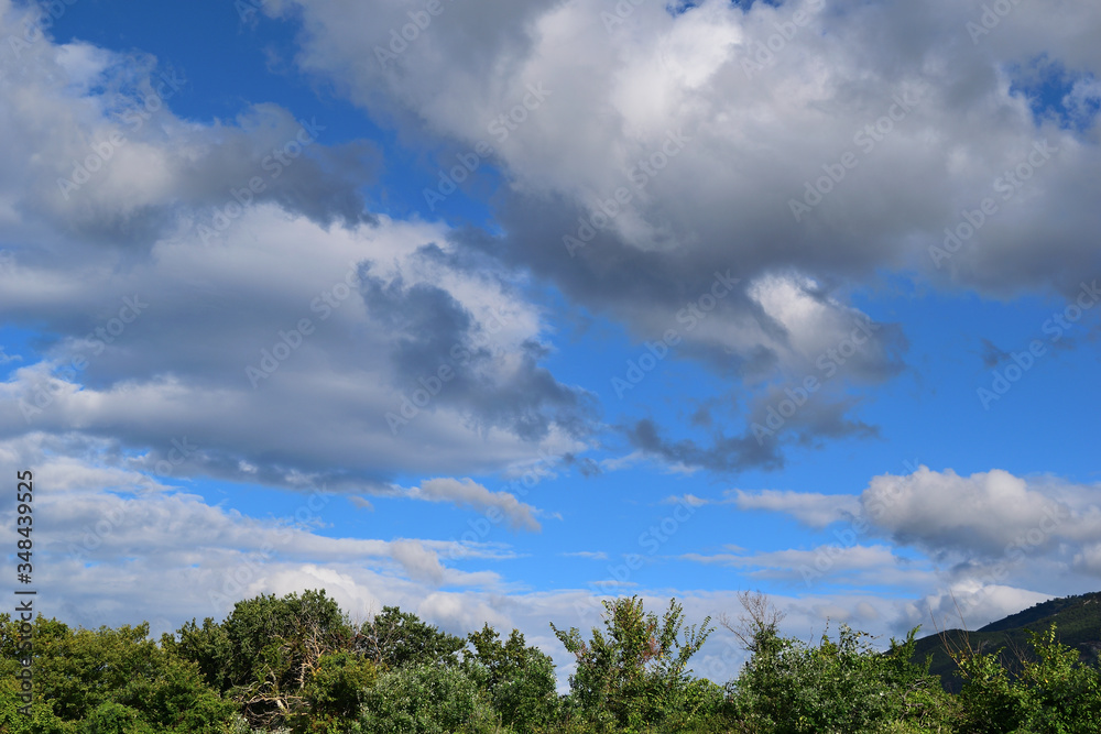 blue sky with clouds over forest at Therma beach, Therma, Samothraki island, Greece, Aegean sea