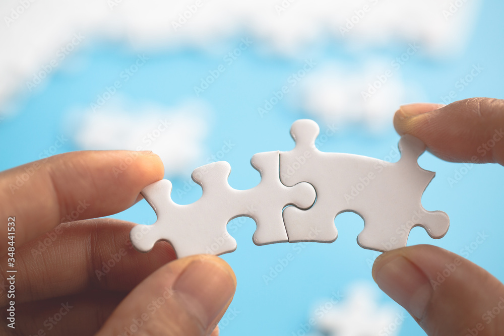 Hand connect jigsaw parts with word problem & solution. symbol of association and connection. business strategy. Teamwork concept. Hand connect jigsaw parts with word problem & solution. symbol of association and connection. business strategy. Teamwork concept.