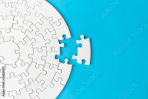 Jigsaw puzzle with missing piece. Completing final task, missing jigsaw puzzle pieces and business concept with a puzzle piece missing. photo
