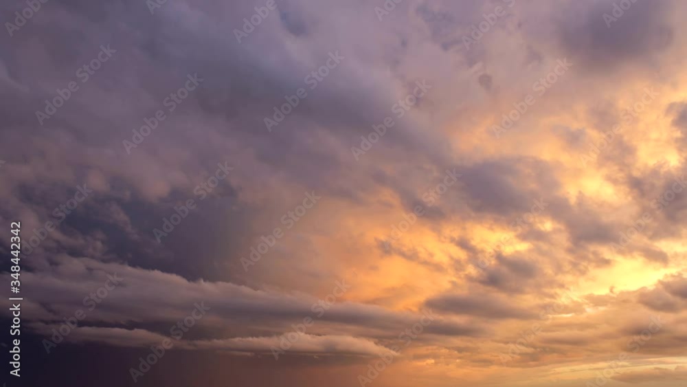 Sunset sky timelapse. Dramatic colorful golden hour, blue and yellow. Dark clouds. Sunset sky timelapse. Dramatic colorful golden hour, blue and yellow. Dark clouds.