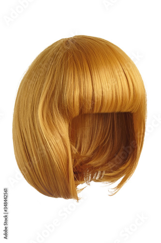 Subject shot of a golden yellow wig with bangs. The short blunt bob wig is isolated on the white background. 