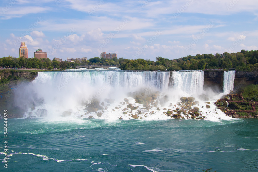 Stunning view of Niagara Falls with blue sky background in Ontario, Canada Stunning view of Niagara Falls with blue sky background in Ontario, Canada