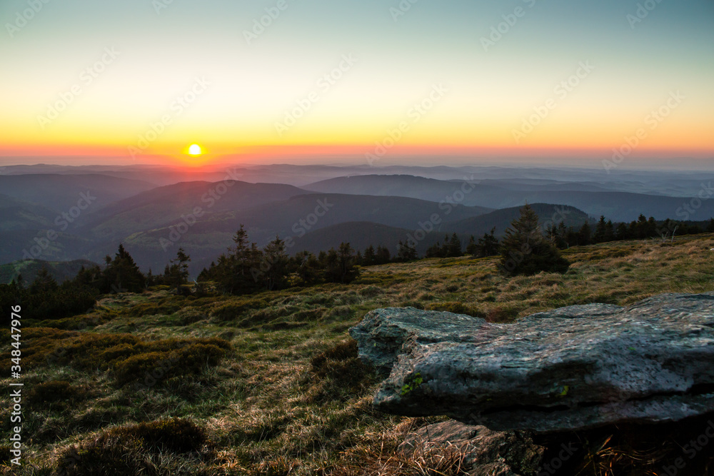 Sunrise over the Jeseníky Mountains, Czech Republic, with a stone in the foreground.