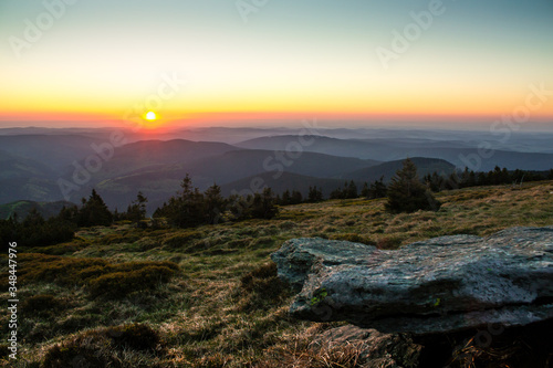 Sunrise over the Jeseníky Mountains, Czech Republic, with a stone in the foreground.