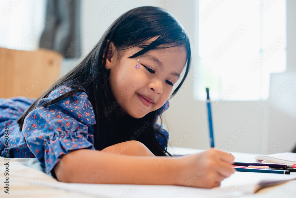 Girl doing homework, kid writing paper, education concept, back to school, stay home Girl doing homework, kid writing paper, education concept, back to school, stay home