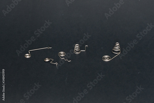 spring and wire forming for industrial use on black background.