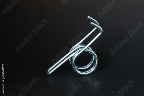 spring and wire forming for industrial use on black background.