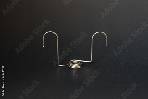 spring and wire forming for industrial use on black background.