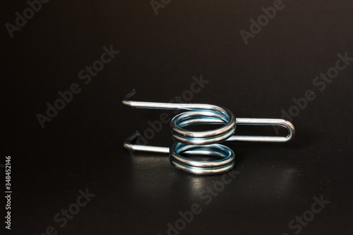 spring and wire forming for industrial use on black background.