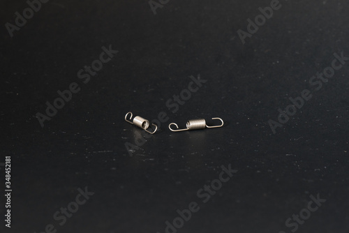 spring and wire forming for industrial use on black background.