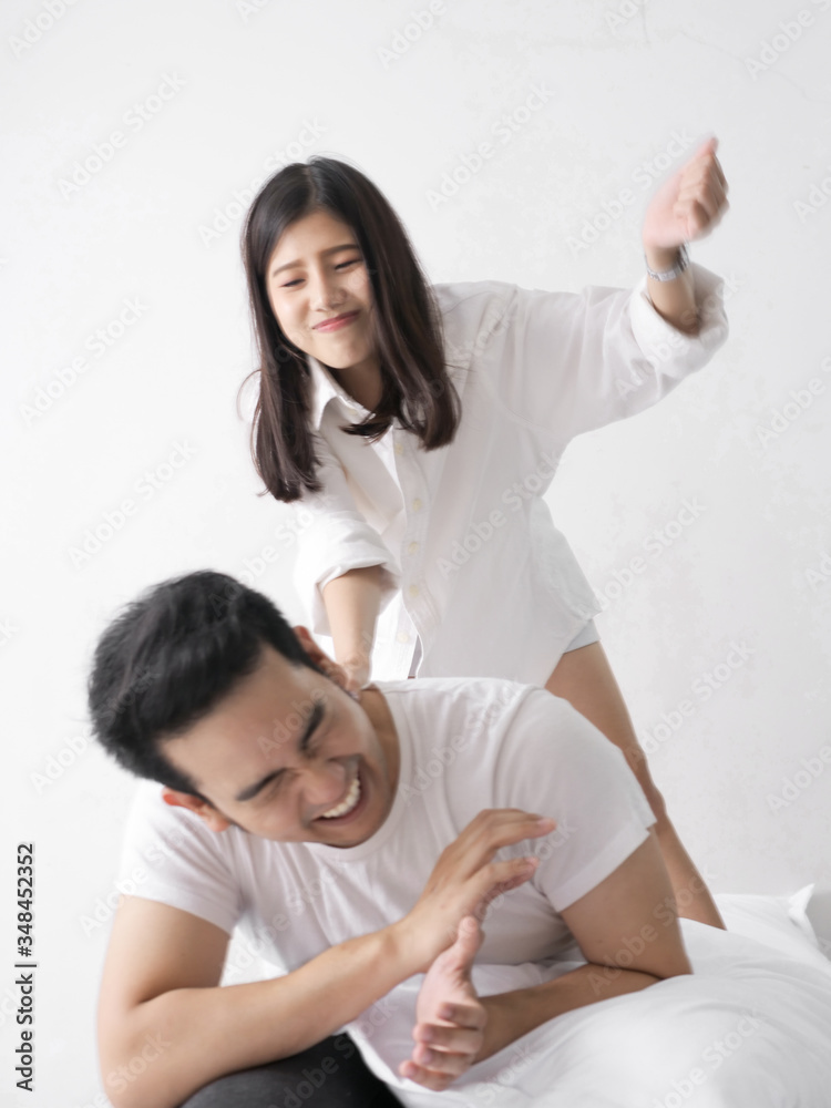 Asian family fight. Furious wife hurt husband after unfaithful, motion blur.