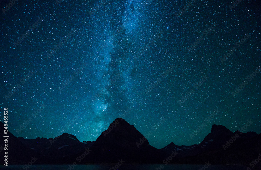 Swiftcurrent Lake at night with star in Many Glacier area ,Montana's Glacier National Park,Montana,usa. Swiftcurrent Lake at night with star in Many Glacier area ,Montana's Glacier National Park,Montana,usa.