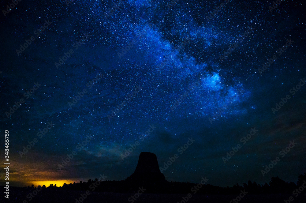 beautiful devil tower at night with milkyway in the clear sky. wyoming,usa.