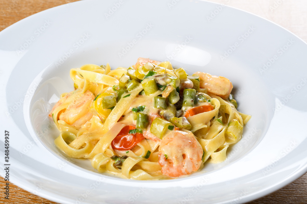 Italian tagliatelle with asparagus and shrimps or scampi, dill cream sauce.Fresh Food Dining Eating