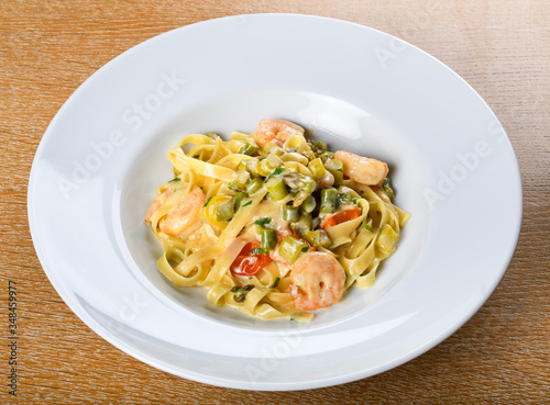 Italian tagliatelle with asparagus and shrimps or scampi, dill cream sauce.Fresh Food Dining Eating
