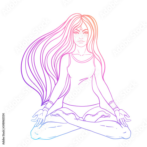 Chakra concept. Girl sitting in lotus position over colorful ornate mandala. ...