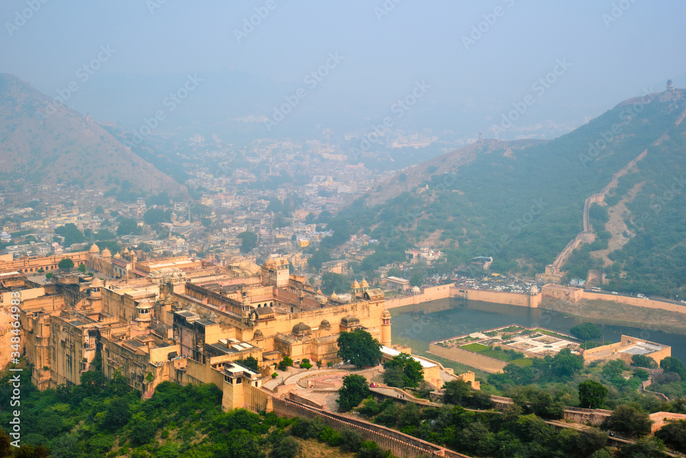 Indian travel famous tourist landmark - view of Amer (Amber) fort and Maota lake from Jaigarh Fort. Jaipur, Rajasthan, India