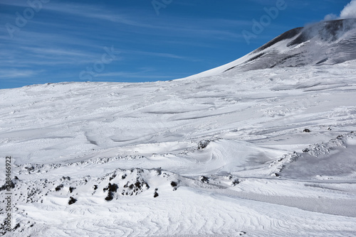 Snowy side of a volcano mountain in Sicily