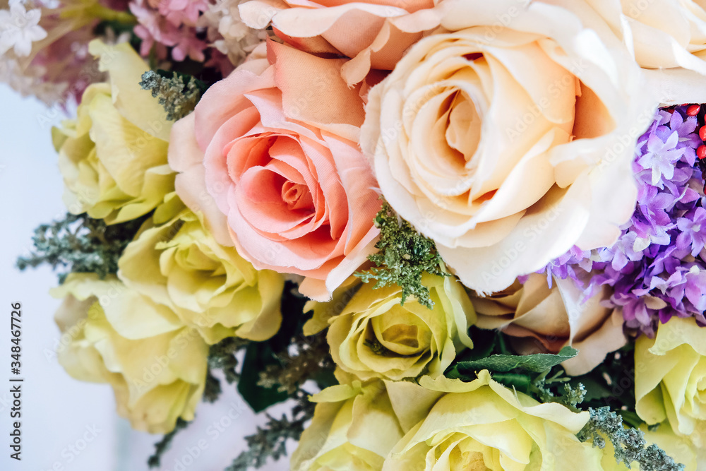Obraz premium Floral background. artificial flowers in a colorful