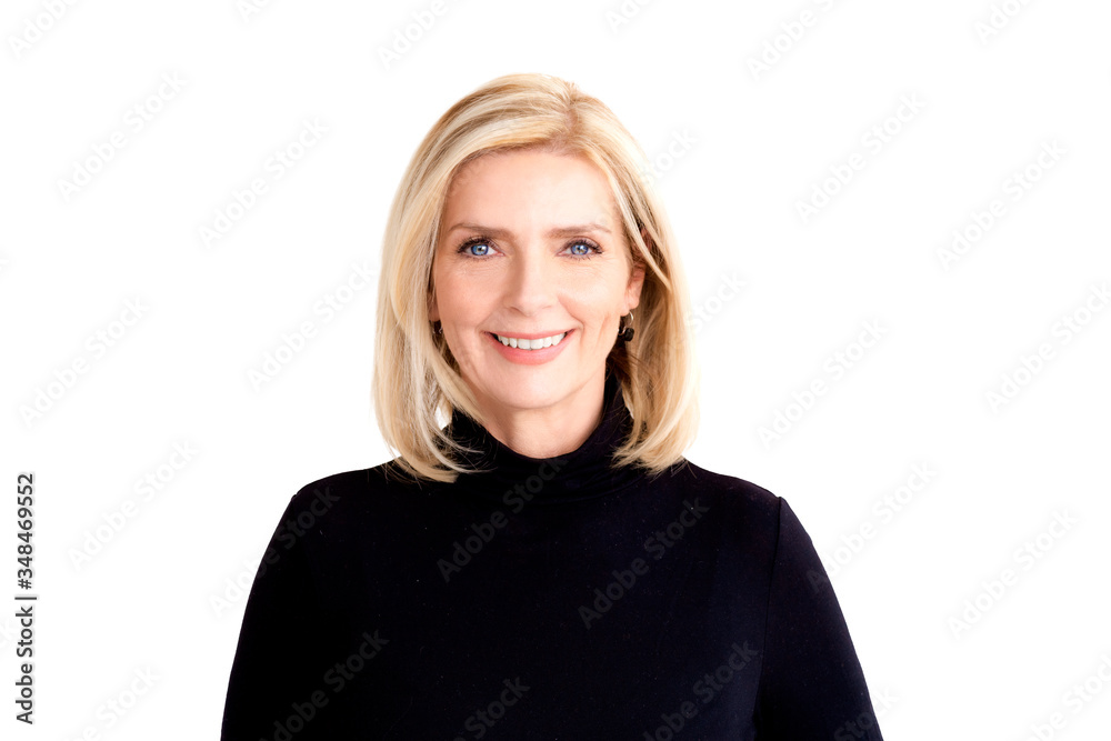 Attractive blond woman looking at camera and smiling while standing at isolated white background Attractive blond woman looking at camera and smiling while standing at isolated white background