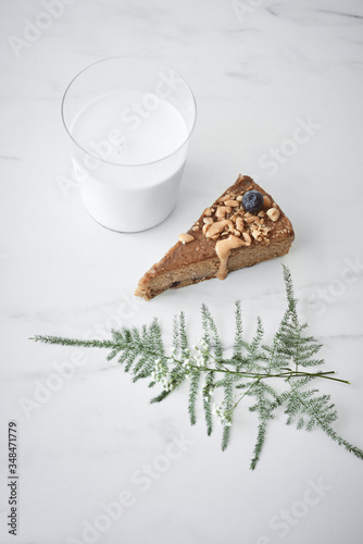 Peanut butter cake with milk in glass