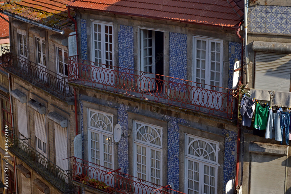 Porto, Portugal - August 17, 2015: Cityscape of Porto. Focus on old buildings with azujelos on facade. 
