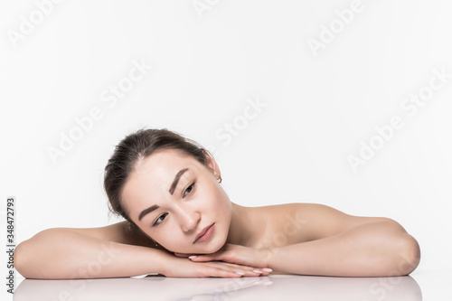 Beautiful face skincare beauty asian woman lying down with mirror reflection isolated on white background.