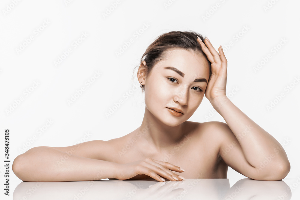 Charming asian woman face while lying isolated on white background