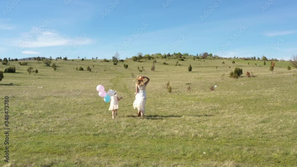 Happy young mother and daughter having fun in the nature park Happy young mother and daughter having fun in the nature park