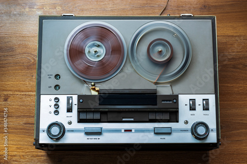 start of old tape recorder, play, pause, rewind, man playing