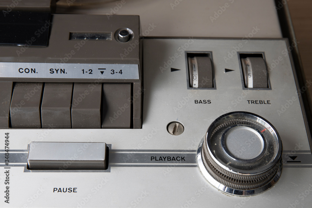Fototapeta premium start of old tape recorder, play, pause, rewind, man playing