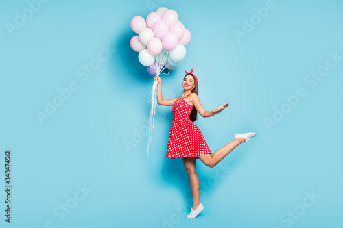 Full length body size view of her she nice attractive carefree dreamy cheerful cheery straight-haired girl holding air balls jumping isolated on bright vivid shine vibrant blue color background