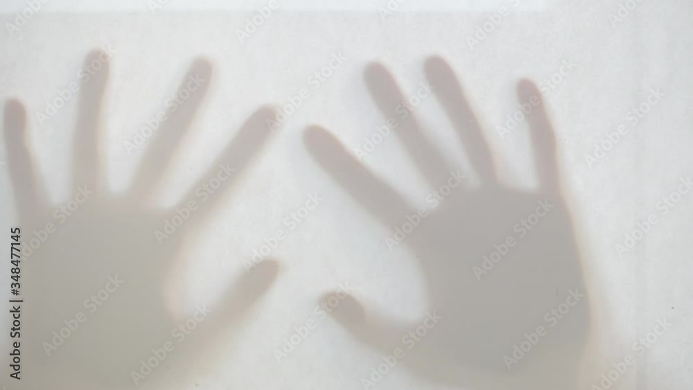 There are two ghost shadows of hands. There are two ghost shadows of hands.