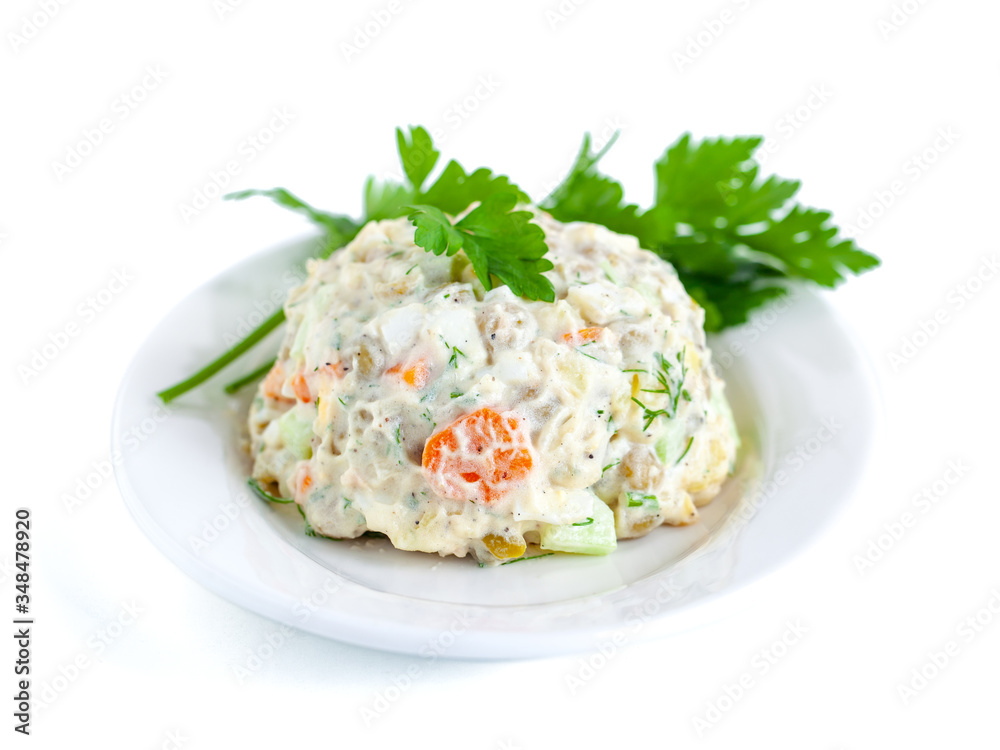 The vinaigrette of various boiled vegetables withe parsley on the plate The vinaigrette of various boiled vegetables withe parsley on the plate