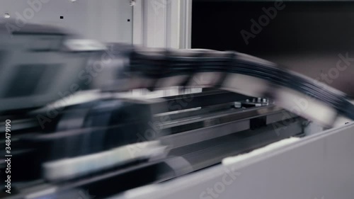 Moving print head of a large printing press.