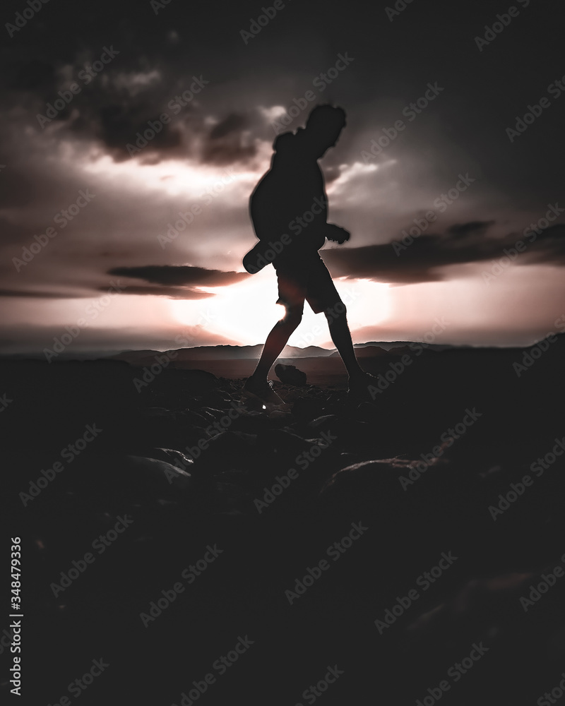 Silhouette of Man or People in Red Orange Moody Sunset or Sunrise