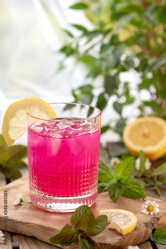 Glass of lemonade with red matcha, close up Glass of lemonade with red matcha, close up
