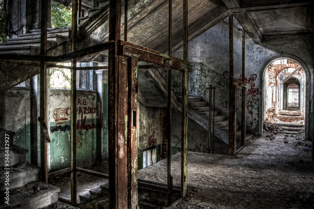 Remains of an elevator and an abandoned staircase in an old building