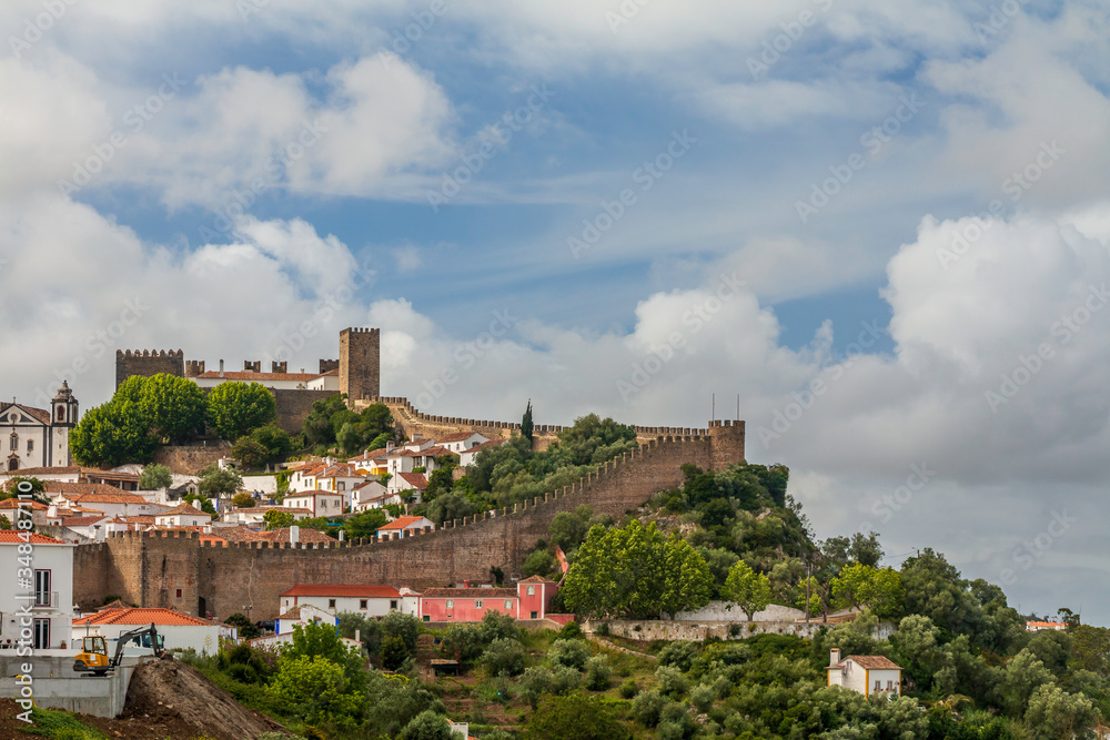 Street views, castle walls and churches of Obidos, Portugal.