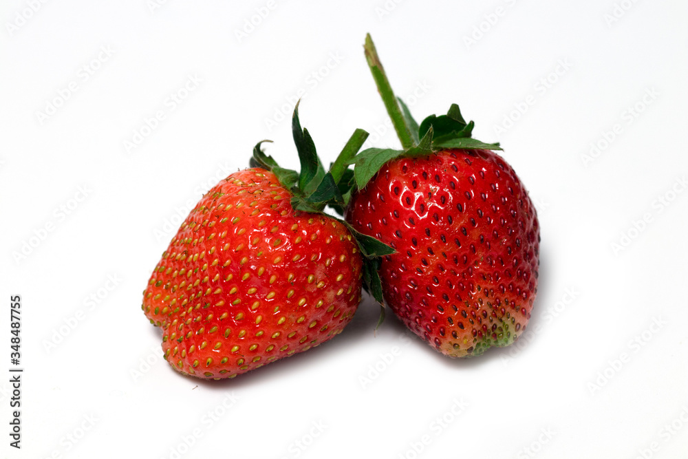 Strawberries are arranged in different styles on a white background. Strawberries are arranged in different styles on a white background.