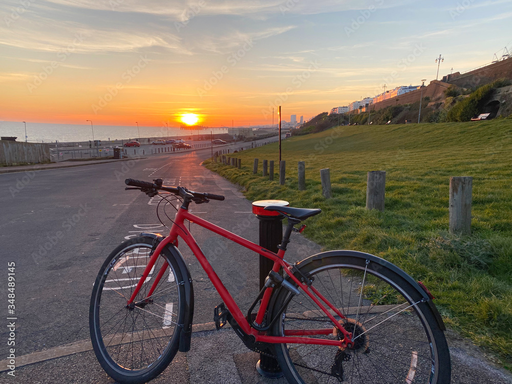 Fototapeta premium Road bike by the beach with a summer sunset, Brighton, UK