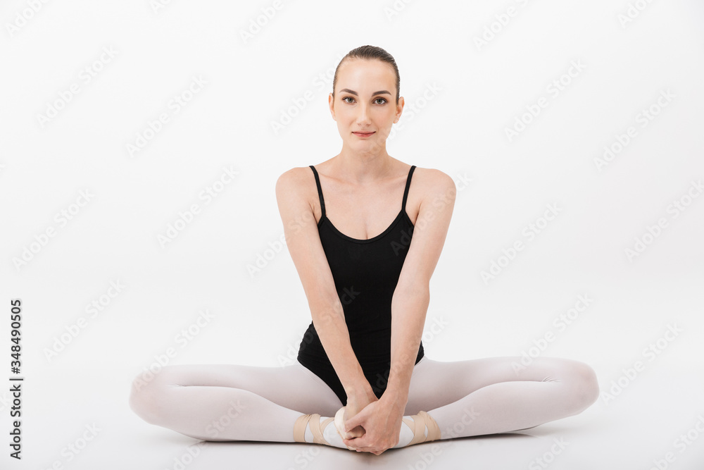 Image of caucasian woman ballerina practicing and stretching her body Image of caucasian woman ballerina practicing and stretching her body