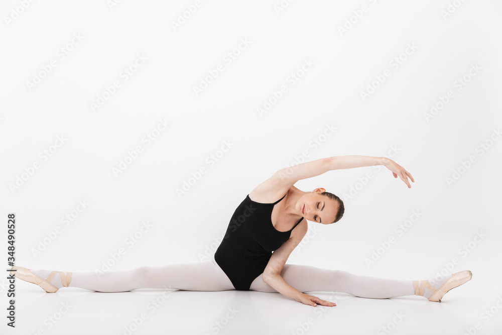 Image of caucasian woman ballerina practicing and stretching her body Image of caucasian woman ballerina practicing and stretching her body