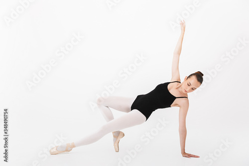 Image of caucasian woman ballerina practicing and dancing gracefully