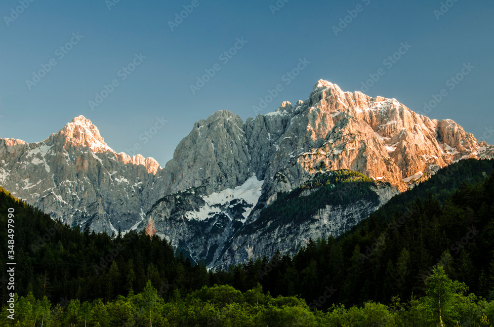 Beautiful sunset on the impressive wall of mountains in the slovenian alps