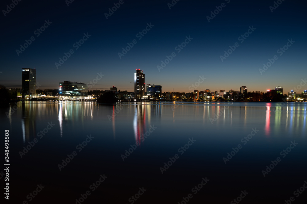 Night cityscape from Keilaniemi, Espoo business district showcasing the oldest highrise building in Finland.