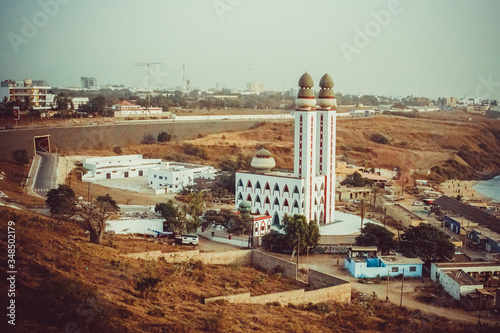 Dakar mosque photographed from the throne on a Sunny day with views of the ocean and coast